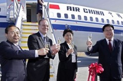 Officials of Civil Aviation Administration of China (CAAC) and Air China celebrate the delivery of a Boeing Next-Generation 737-800.
