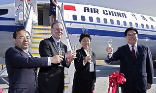 Officials of Civil Aviation Administration of China (CAAC) and Air China celebrate the delivery of a Boeing Next-Generation 737-800.