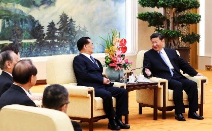President Xi Jinping meets with Lien Chan, former chairman of Taiwan's Kuomintang Party, and other Taiwan officials, who are in Beijing to attend the celebrations on Sept. 3.