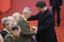 Chinese President Xi Jinping bestows medals to veterans of World War II in a ceremony held at the Great Hall of the People in Beijing.