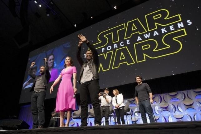 Star Wars: The Force Awakens cast members (L -R) Oscar Isaac, Daisy Ridley, John Boyega, writer, director and producer J.J. Abrams, producer Kathleen Kennedy and show host Anthony Breznican appear at the kick-off event of the Star Wars Celebration convent