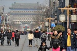 Tourists visit the Qianmen Street, a well-known commercial street in Beijing.