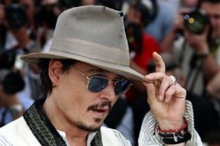 Cast member Johnny Depp poses during a photocall for the film ''Pirates Of The Caribbean: On Stranger Tides'' at the 64th Cannes Film Festival, May 14, 2011.