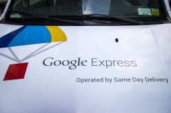 The Google Express logo is seen on one of its delivery trucks parked in New York. According to reports, Google plans to return to China with a new App Store.
