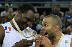France's Florent Pietrus and Tony Parker celebrate after they receive the gold medal during the 2013 EuroBasket.