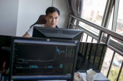 A man working at his computer in his office in Hangzhou, Zhejiang Province.