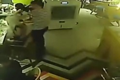 A CCTV recording shows Zhu, a young waiter at Mr. Hot Pot in Wenzhou, pouring hot water on the female diner, Lin.