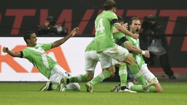 Dutch forward Bas Dost (R) and the rest of his VfL Wolfsburg teammates move on without Kevin De Bruyne.