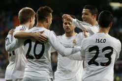 Real Madrid stars celebrate after scoring a goal against Espanyol in a Copa del Rey match last year.