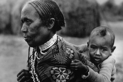 Grandmother carrying a child in Borana, Ethiopia.