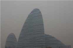 A commercial building is pictured on a polluted day in Beijing