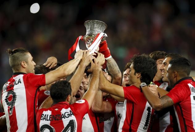 Athletic Bilbao players raise up the Spanish Super Cup trophy after defeating Barcelona at Camp Nou on Aug. 17. 