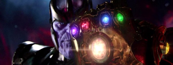 Thanos is wearing the Infinity Gauntlet with the six Infinity Stones.