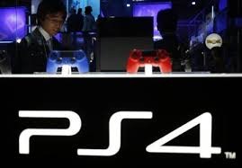 A visitor looks at Sony Corp's new PlayStation 4 game console at the Tokyo Game Show.