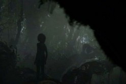 A silhouette of Mowgli standing on tree branches has been featured in Jon Favreau's 