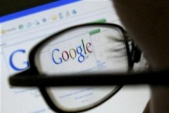 A Google search page is seen through the spectacles of a computer user in Leicester, central England July 20, 2007.