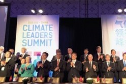 Local officials from China and the United States cheer after signing the Climate Leaders declaration at the 
