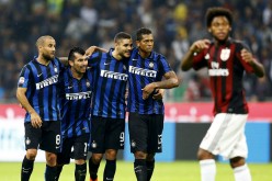 Inter Milan players celebrate as they defeat AC Milan, 1-0, in a recent derby.