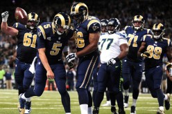 St. Louis Rams quarterback Nick Foles (#5) celebrate with teammates during their last game against the Seattle Seahawks.