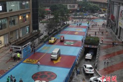 The cartoon-painted road in Chongqing measures 178 meters long and 12 meters wide. 