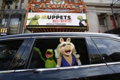 The characters of Kermit and Miss Piggy arrive at the premiere of 'Muppets Most Wanted' in Hollywood, California in this file photo taken March 11, 2014.