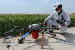 A technician prepares a drone to spray insecticide in Shijiazhuang, north China's Hebei Province, in this May 19, 2015 photo. 
