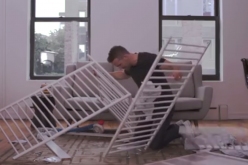 Ryan Reynolds tries to assemble baby crib.