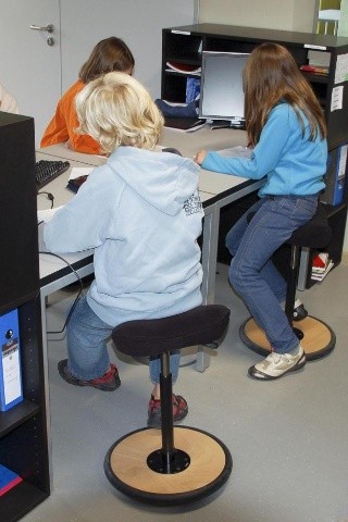 Girls Sitting at Desks 