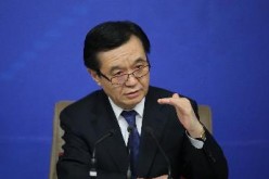Commerce Minister Gao Hucheng answers questions during a press conference for the third session of China's 12th National People's Congress in Beijing, March 2015.