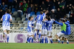Real Sociedad players celebrate a goal by striker Imanol Agirretxe.