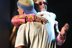 Openly gay Elton John hugs 
