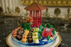 A dessert display features a Chinese-style pavilion and bridge, which was made by hand with chocolate.