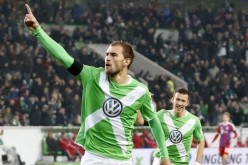 Wolfsburg striker Bas Dost (#12).