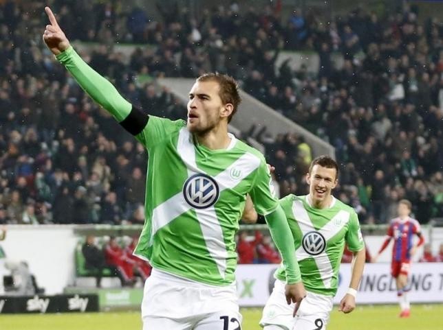 Wolfsburg striker Bas Dost (#12).