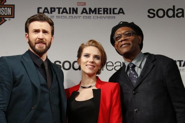 Cast members Chris Evans, Scarlett Johansson and Samuel L Jackson pose at the French premiere of the film ''Captain America: The Winter Soldier'' in Paris.