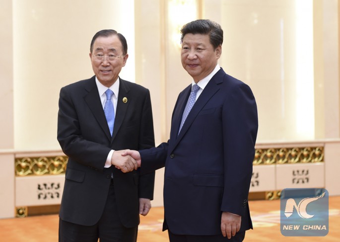 Chinese President Xi Jinping shakes hands with U.N. Secretary-General Ban Ki-moon in Beijing, Sept. 3, 2015.