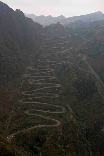 A photo shows the famous "24 Zig," a zigzag road in Qinglong, rural Guizhou Province.