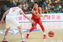 Guo Ailun (6) passes the ball during the match between China and Lebanon at the 2015 Asian Championship in Changsha, Hunan Province, Sept. 28, 2015. China beat Lebanon 90-72.