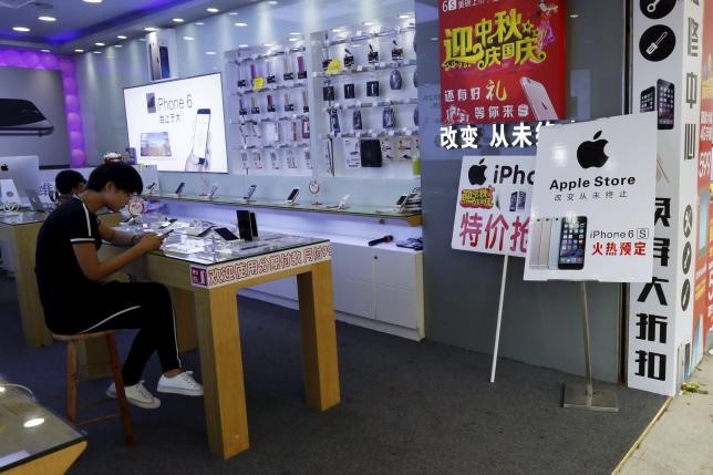 A store with an "Apple Store" sign is seen in Shenzhen, China, Sept. 21, 2015.