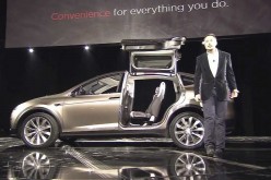 Tesla Model X electric SUV has Falcowing doors that are hinged to a high-strength center-spine on the roof.