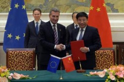 Miao Wei, Minister of Industry and Information Technology, with Günther Oettinger, EU Commissioner for Digital Economy & Society, shake hands after signing the 5G Agreement between the EU and China.