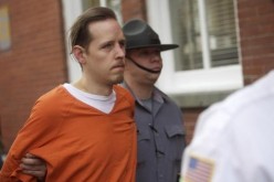 Eric Matthew Frein exits the Pike County Courthouse with police officers after an arraignment in Milford, Pennsylvania, October 31, 2014. 