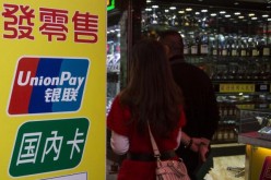 Shoppers browse through the products in a store that accepts UnionPay cards.