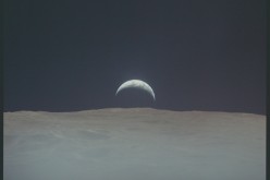 Earthrise from lunar surface during Apollo 12 mission.
