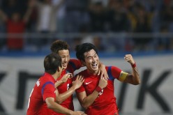 South Korea's Jang Hyun-soo (R) celebrates with teammates after scoring the first goal against Lebanon.