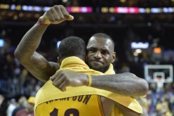 Cleveland Cavaliers' LeBron James hugs teammate Tristan Thompson during the 2015 NBA Finals.