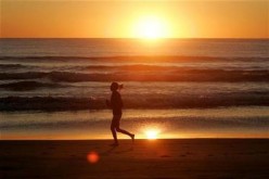 Woman Running on a Beach