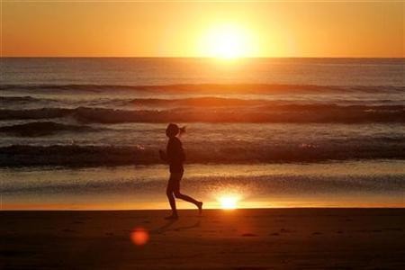 Woman Running on a Beach
