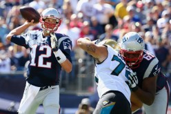 New England Patriots quarterback Tom Brady (#12).