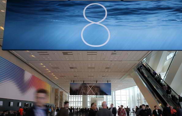 Attendees gather at the Apple Worldwide Developers Conference at the Moscone West center on June 2, 2014 in San Francisco, California. 